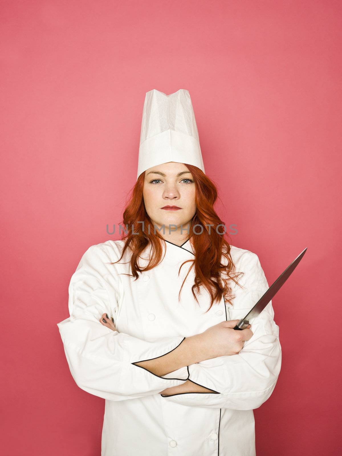 Female Chef on pink background