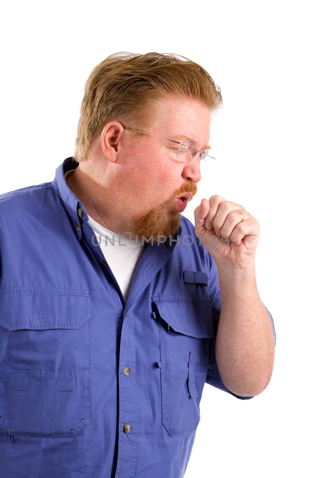 Sick mature man with emphysema coughs into his fist.