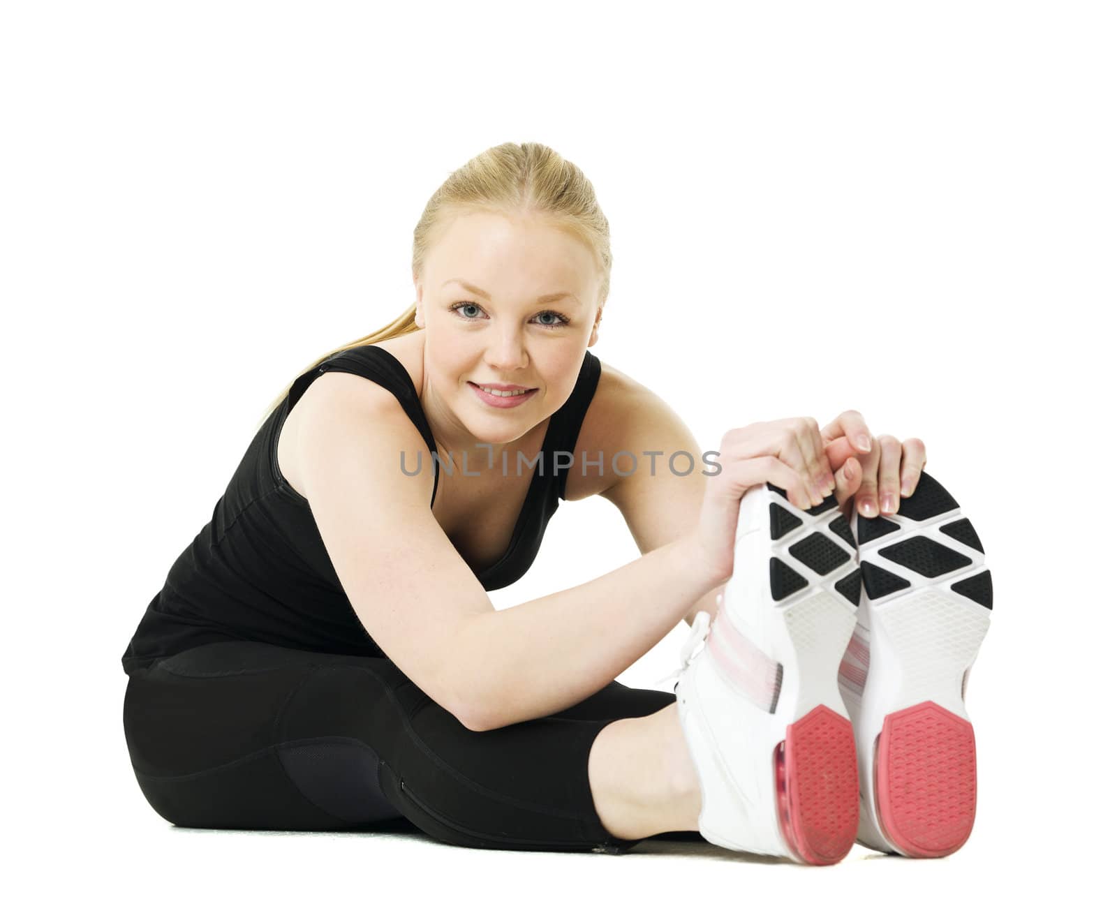 Young blond woman working out isolated on white background