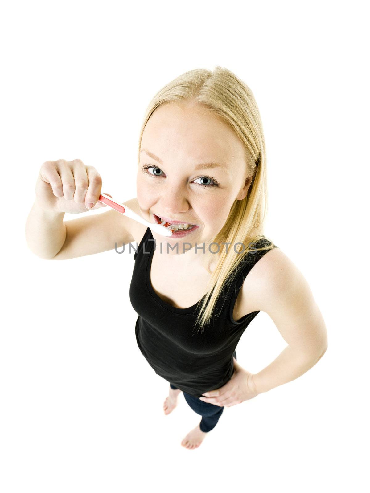 Young woman brushing teeths isolated on white background