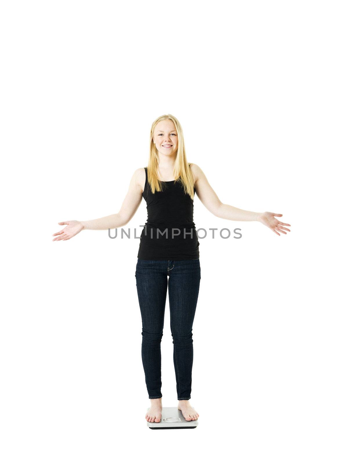 Young Girl on weight scale isolated on white background