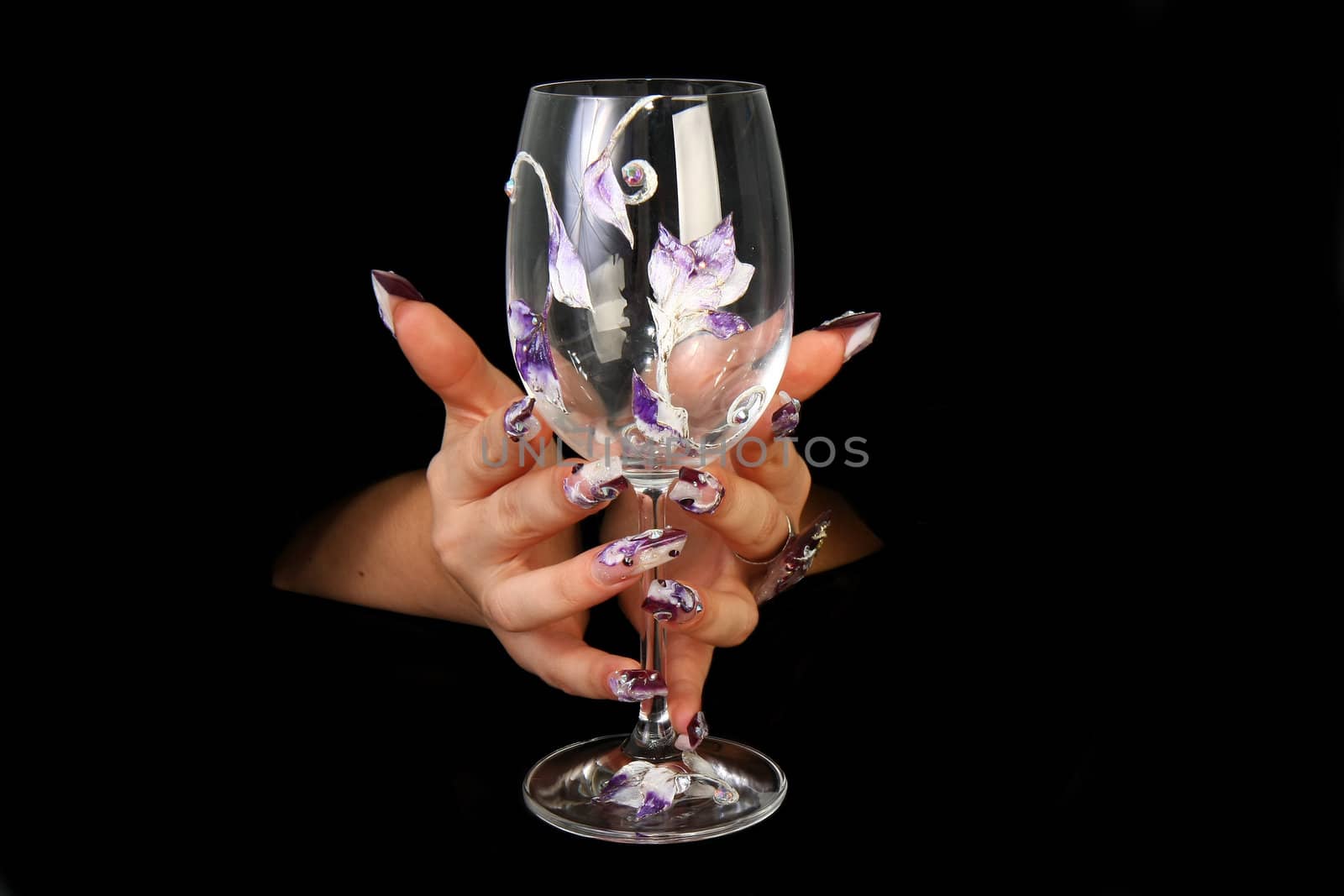 Human fingers with long fingernail and beautiful manicure isolated on black