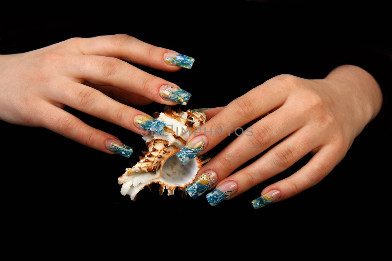 Human fingers with long fingernail and beautiful manicure isolated on black