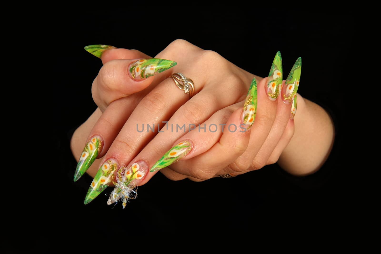Human fingers with long fingernail and beautiful manicure isolated on black