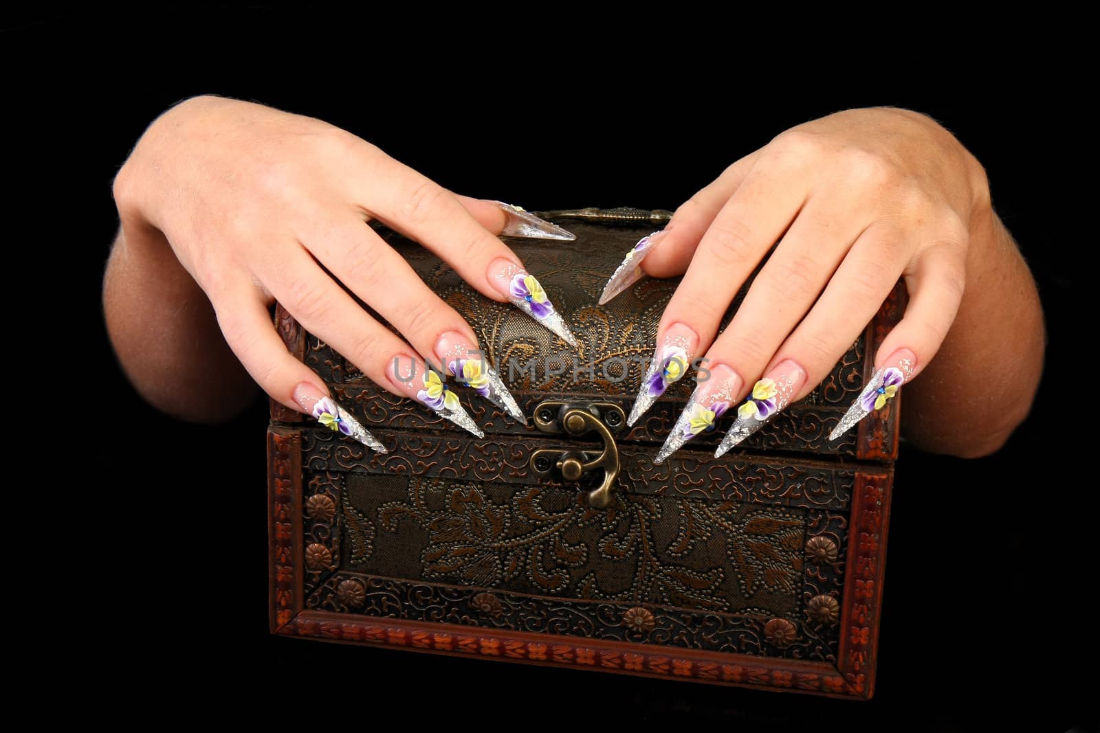 Human fingers with long fingernail and beautiful manicure isolated on black