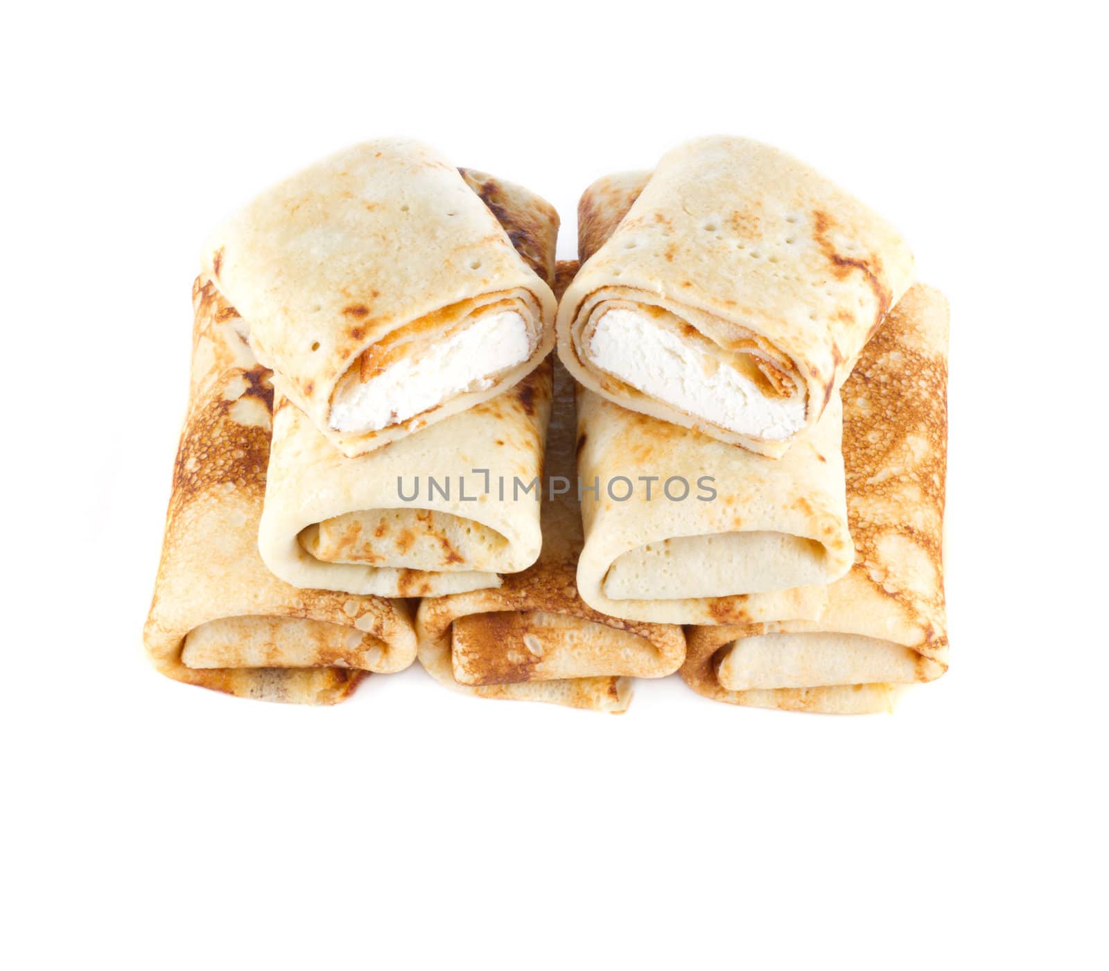 rolled pancakes with cottage cheese on a light background