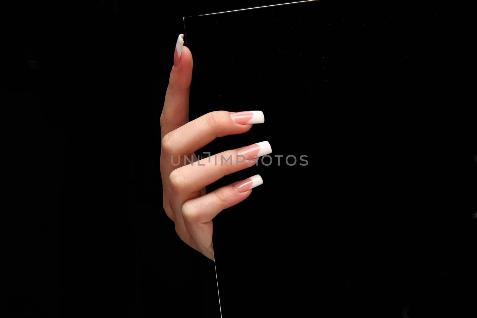 Human fingers with long fingernail and beautiful manicure isolated on black