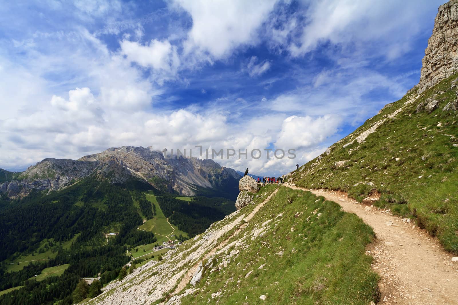hiking on summer over Costalunga pass, Italian Dolomites