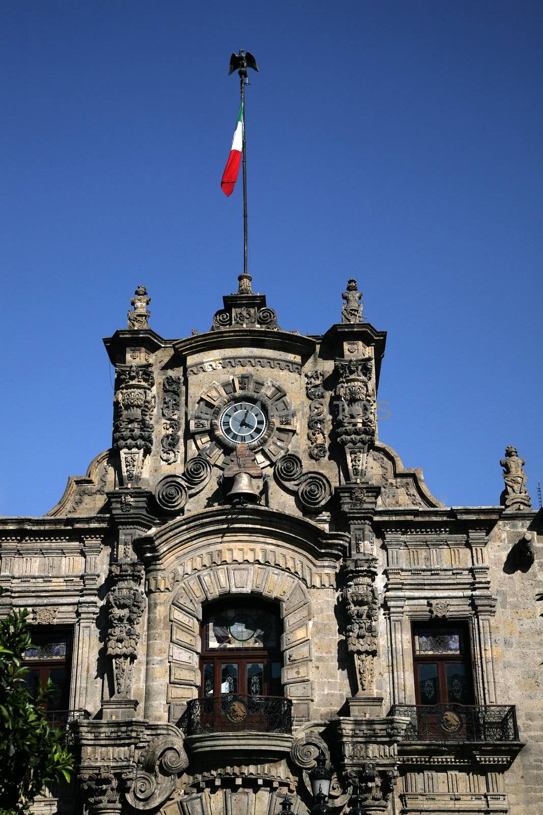 Government Palace with Clock Tower and Flag, Guadalajara, Mexico  This is a very old Spanish style building.