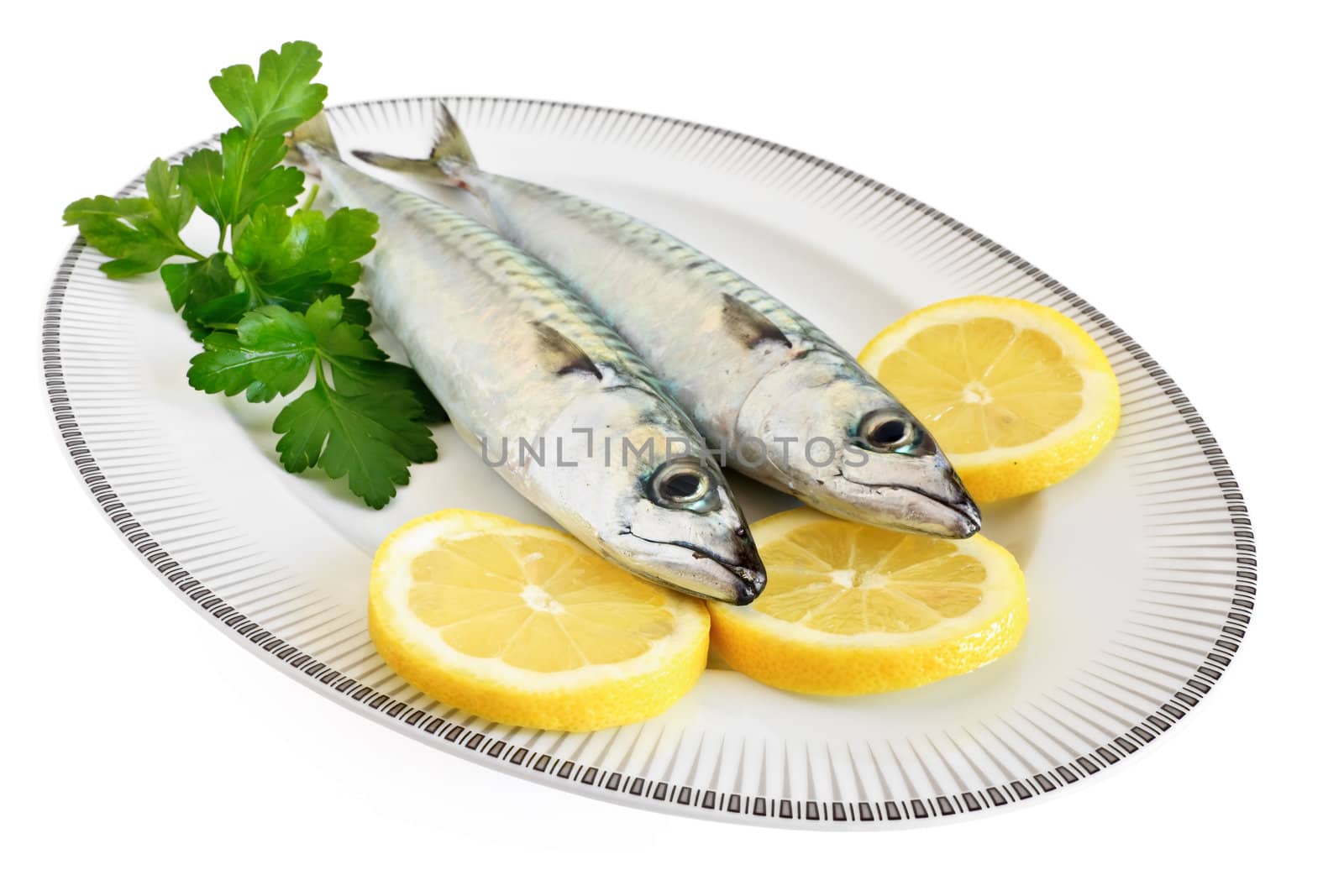 dish with mackerel with lemon and pasley isolated on white background with clipping path