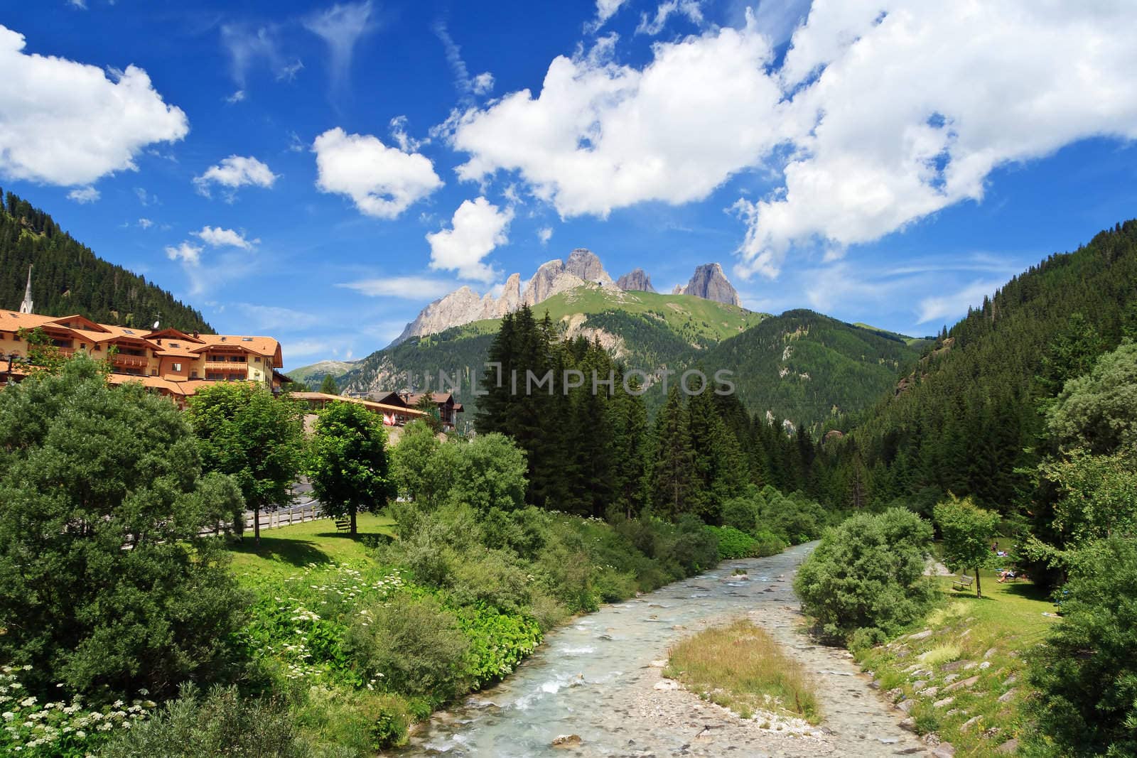 summer view of Avisio river in Fassa Valley, Trentino, Italy