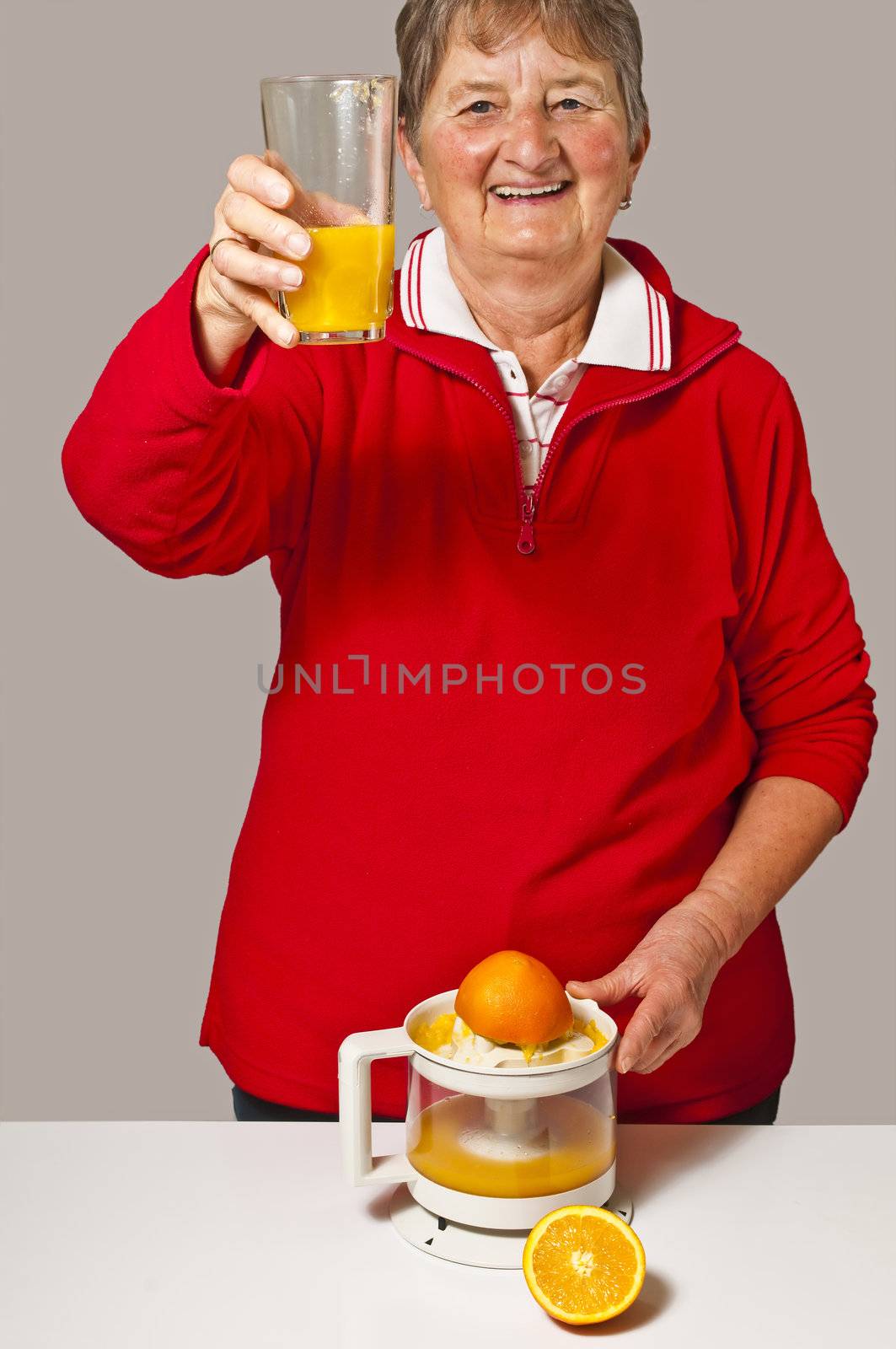 pensioner drinks orange juice by Jochen
