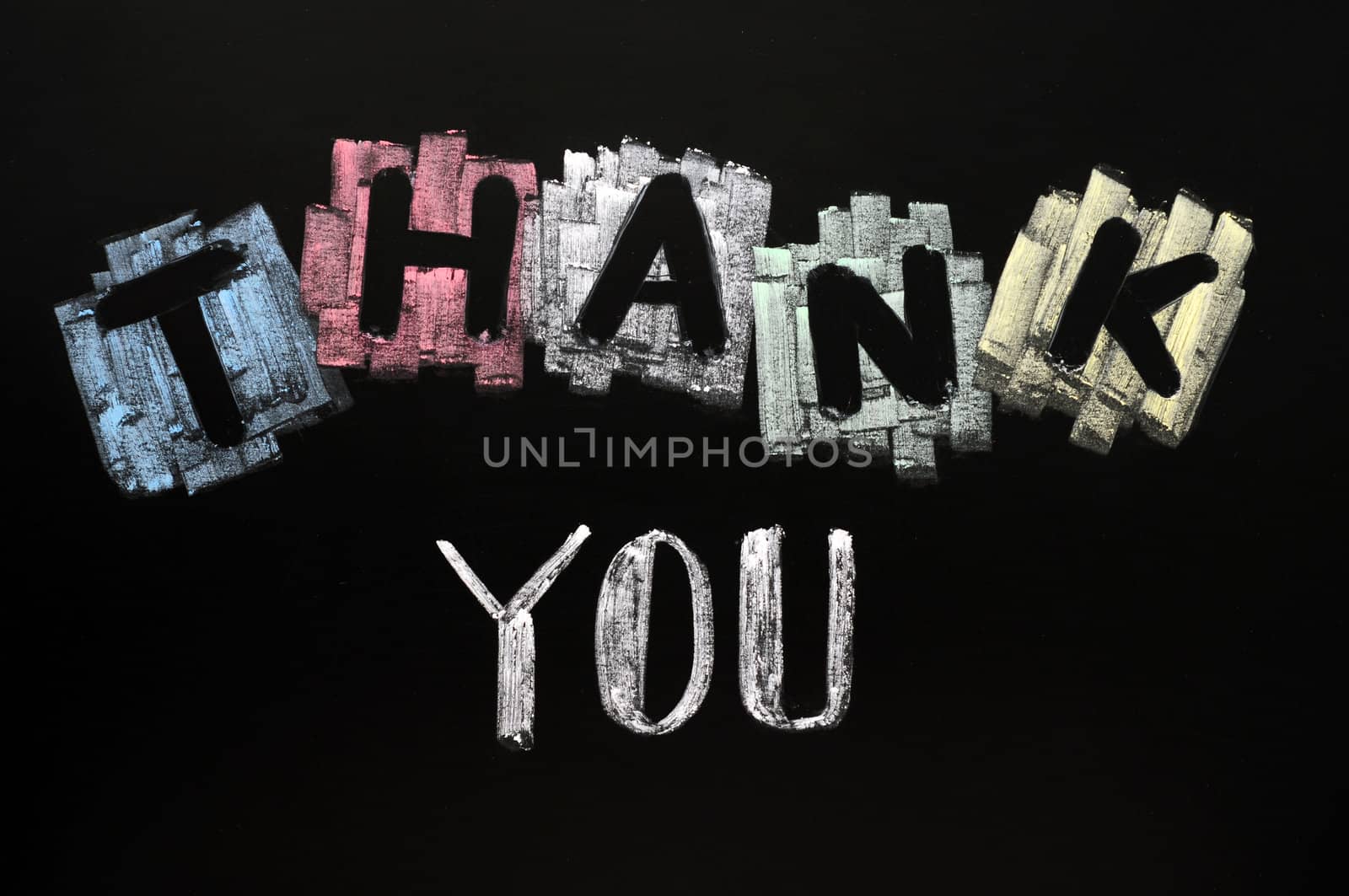 Thank you - text written with colorful chalk on blackboard