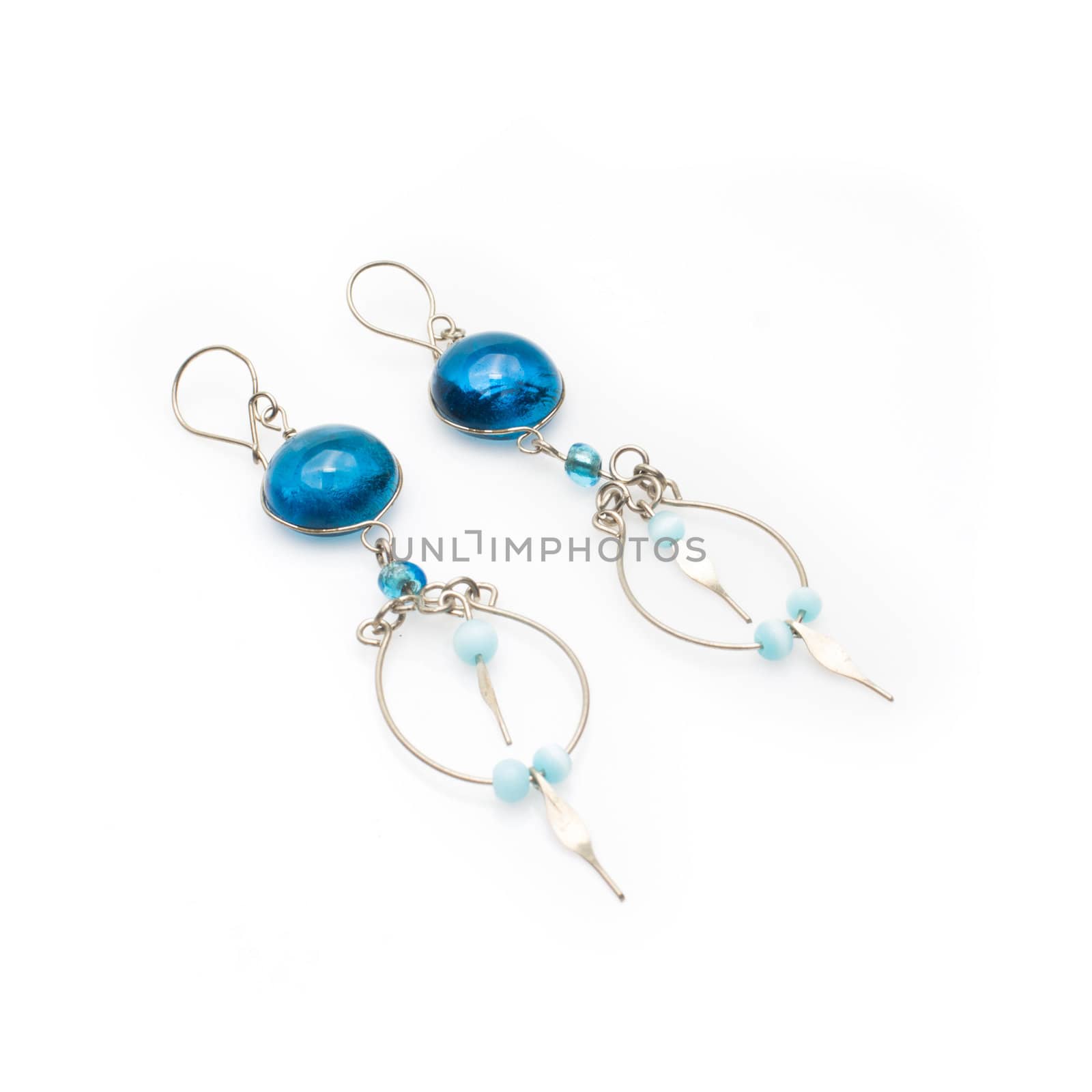 Handmade beaded Peruvian murano glass earrings. Isolated on white background