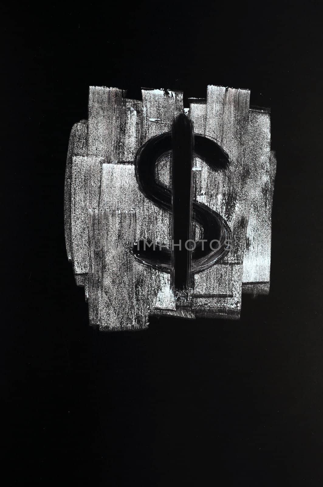 Symbol of US Dollar drawn with chalk on blackboard