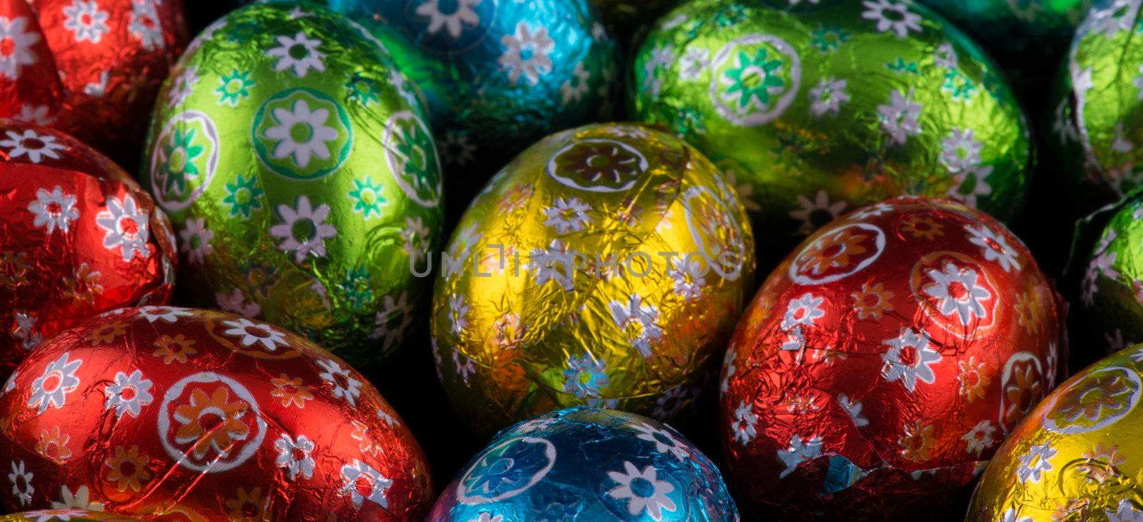 Beautiful colorful tiny Easter Eggs on black background.