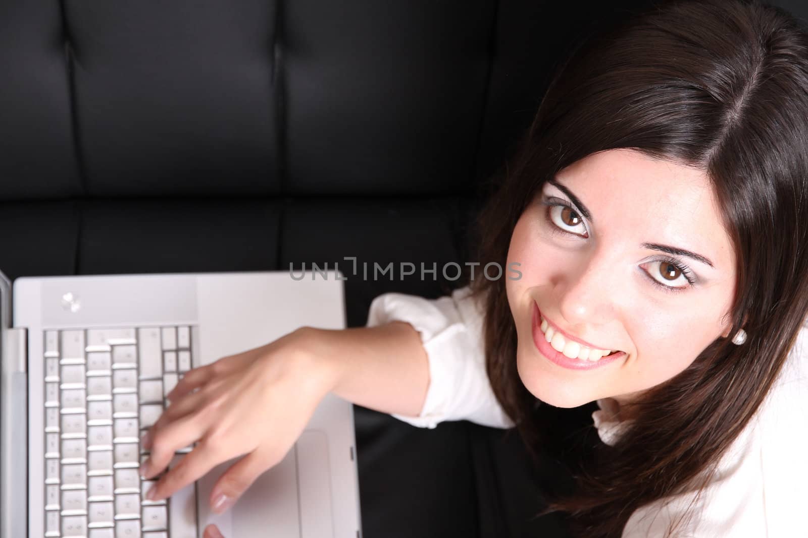 Young Hispanic Woman surfing on the Sofa by Spectral