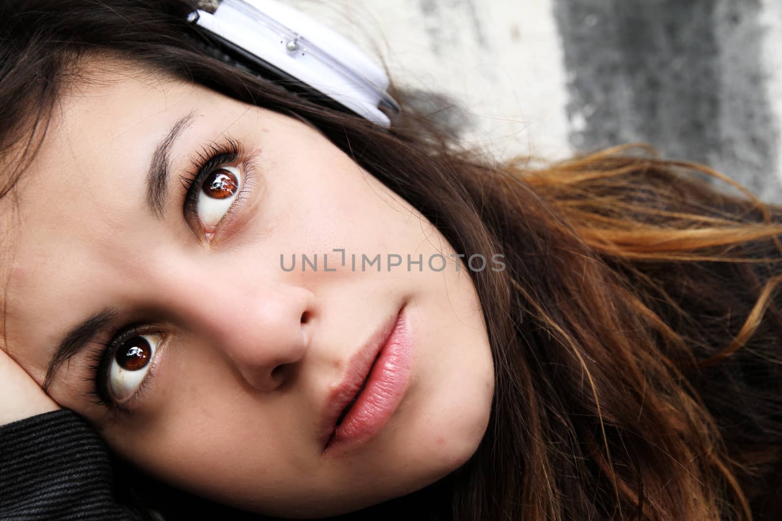 A young woman listening to melancholic Music