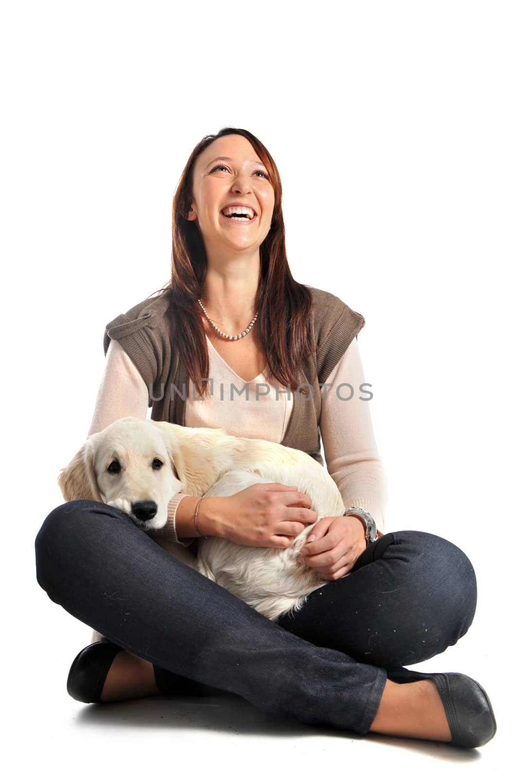 purebred puppy golden retriever and laughing girl in front of a white background
