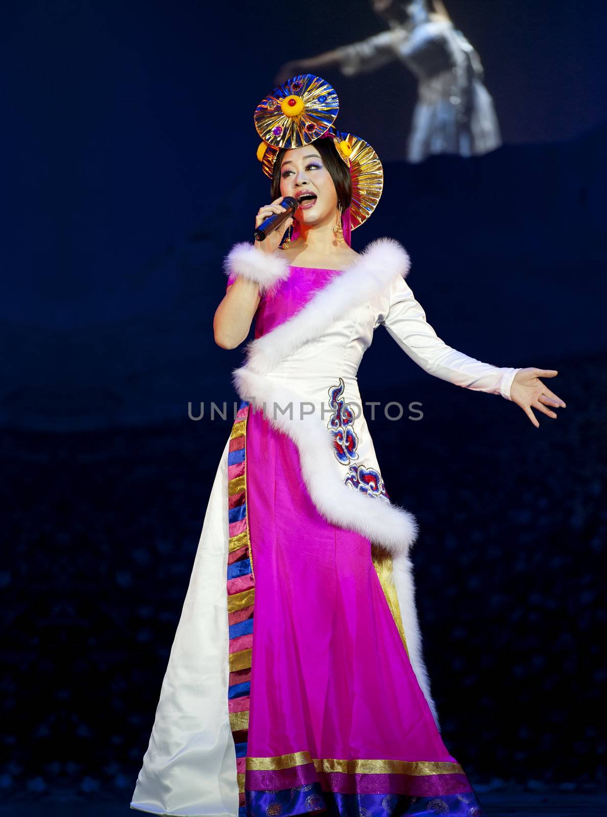 CHENGDU - OCT 17: Tibetan national singer performs folk song on stage at JINCHENG theater on Oct 17, 2011 in Chengdu, China.