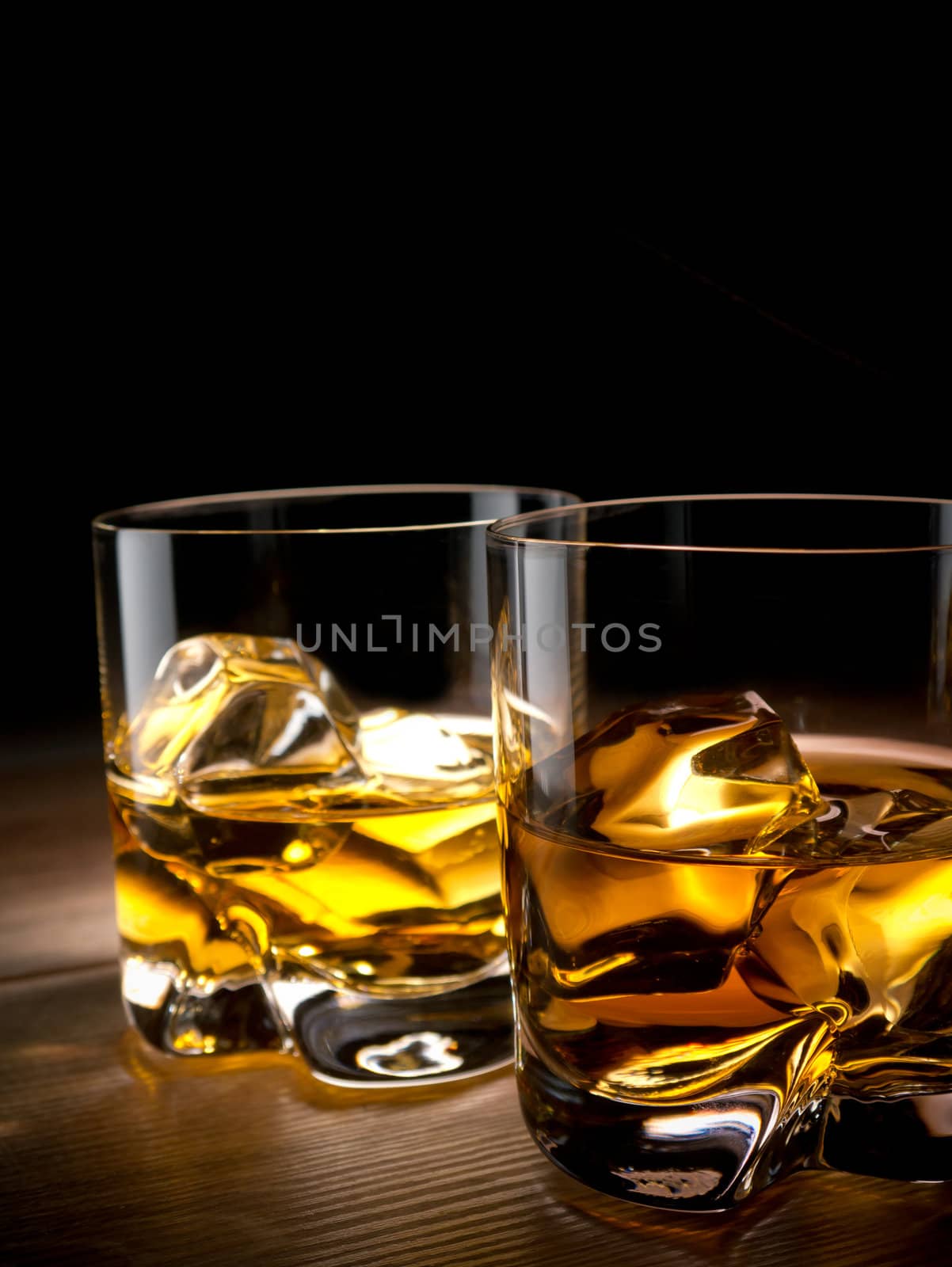 Two glasses of whiskey on the rocks