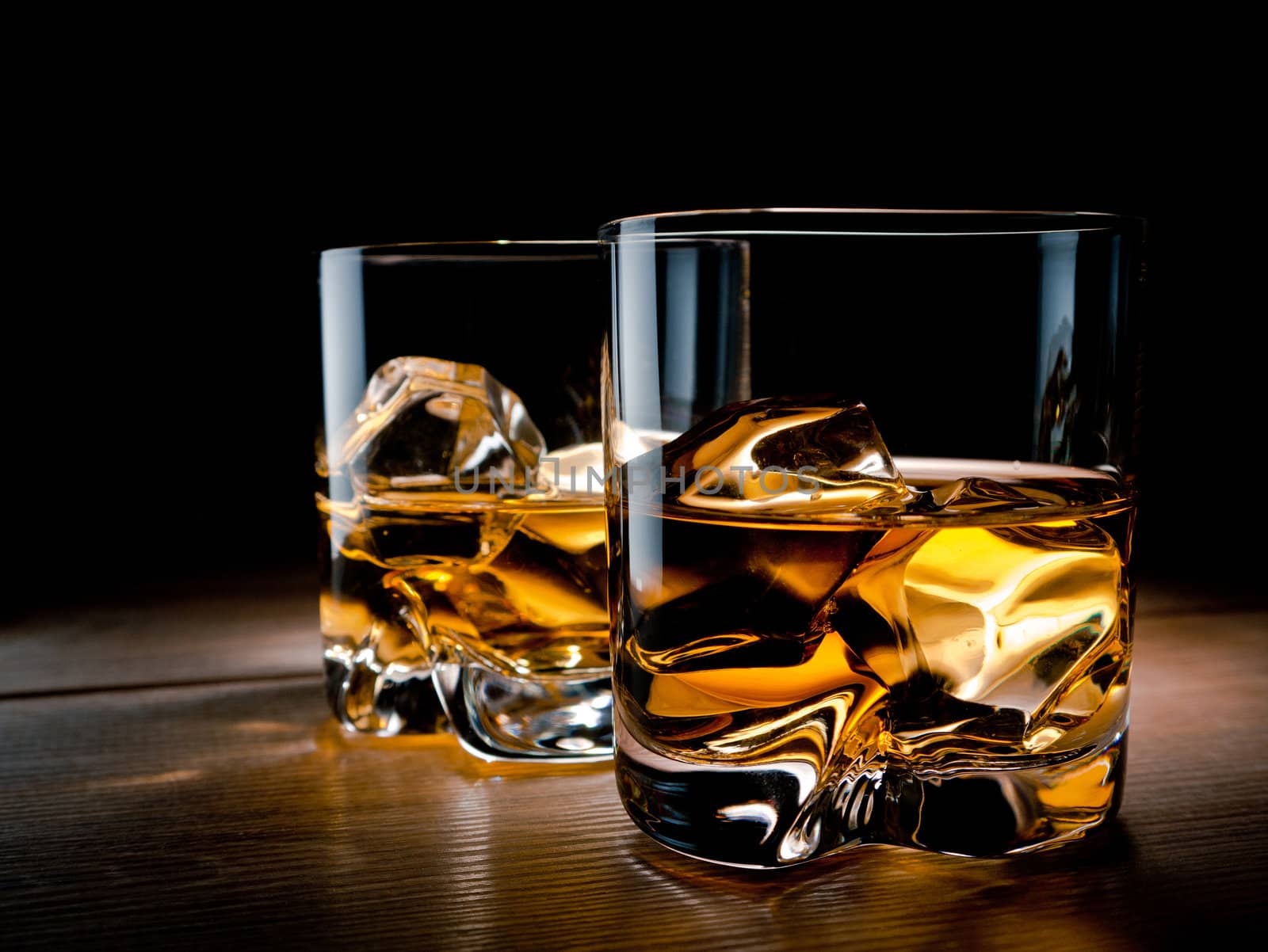 Two glasses of whisky on the rocks