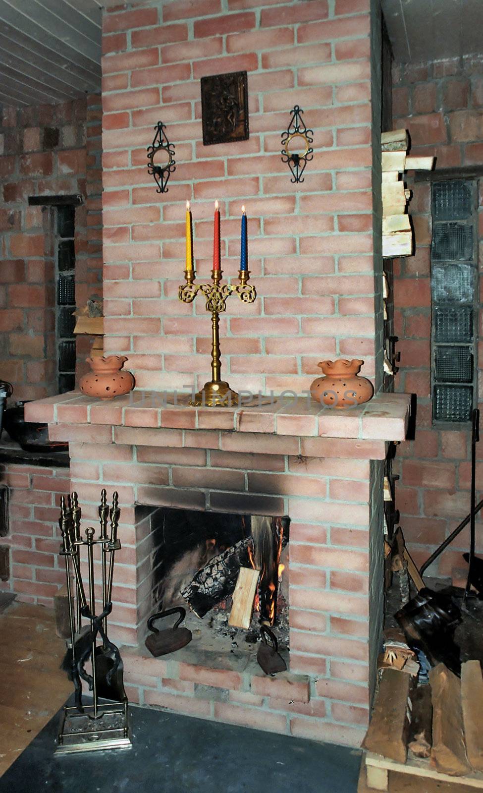 Fireplacewith flame in village build house