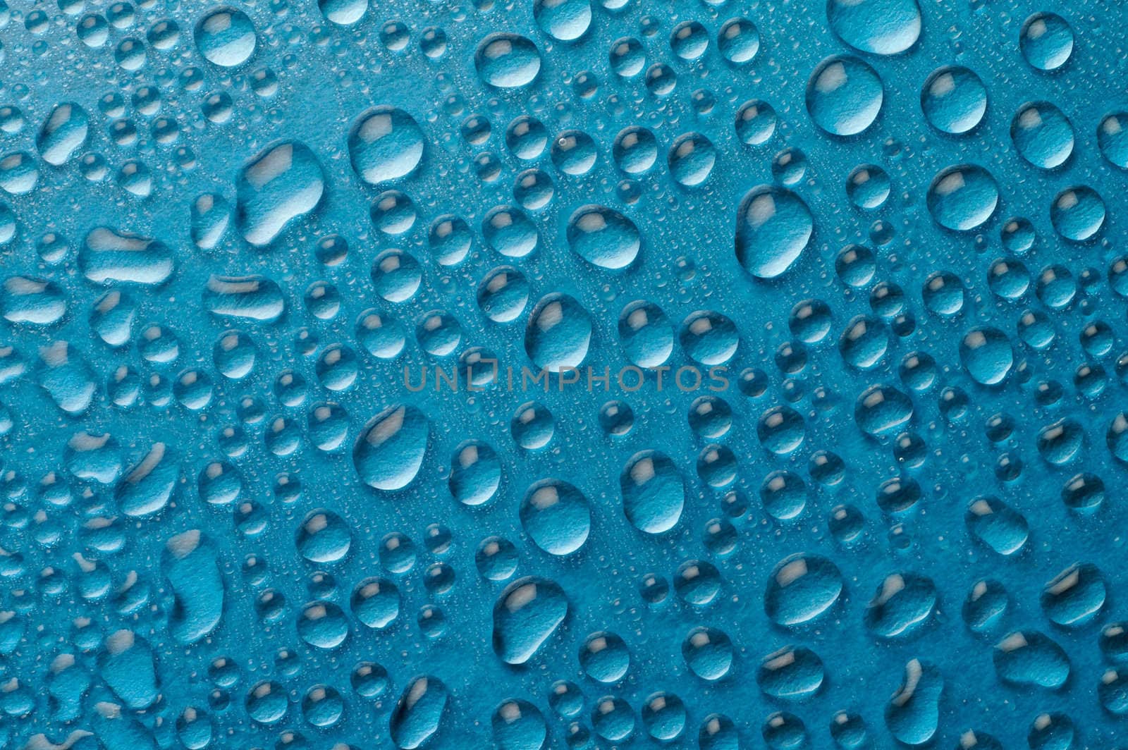 Droplets on blue background by Laborer