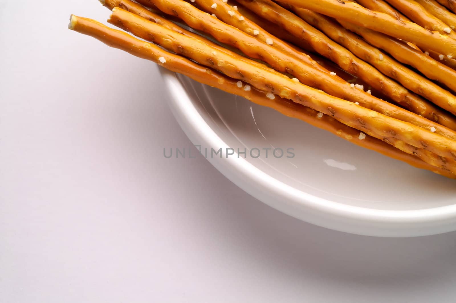  Breadsticks in dish isolated by Laborer