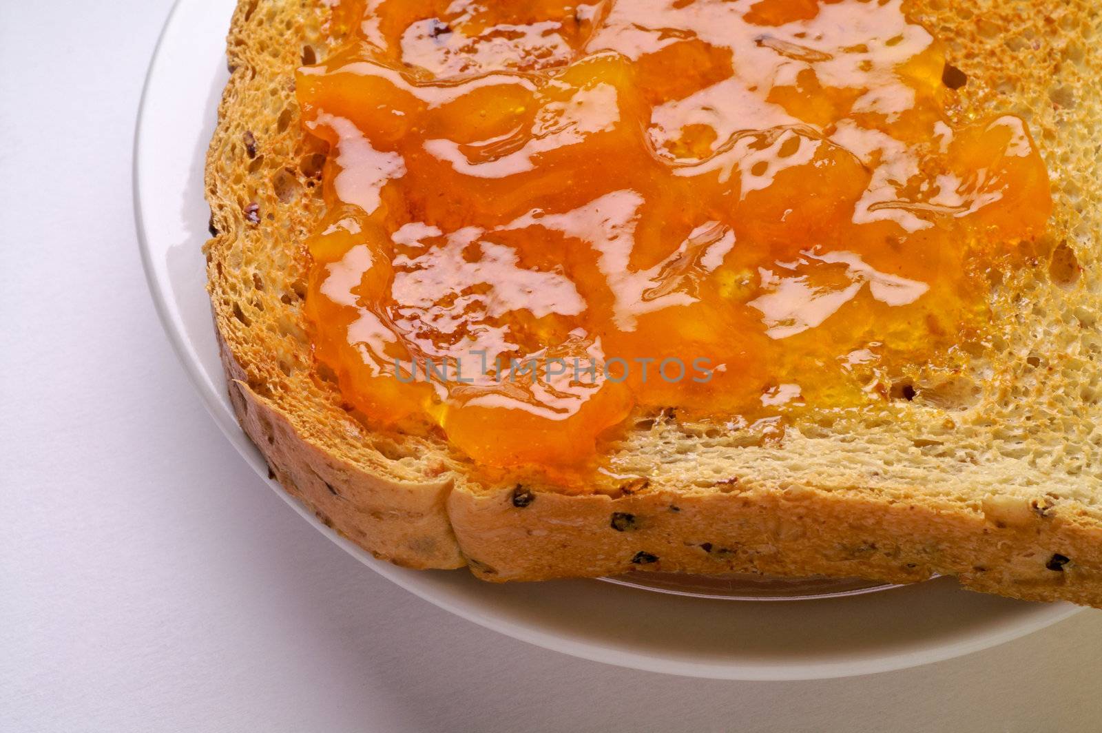 Toast with apricot jam closeup (2)