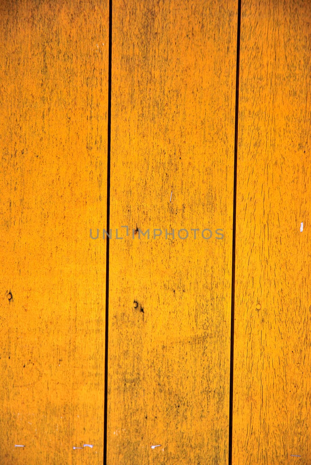 orange wooden boards with paint that was peeling and faded