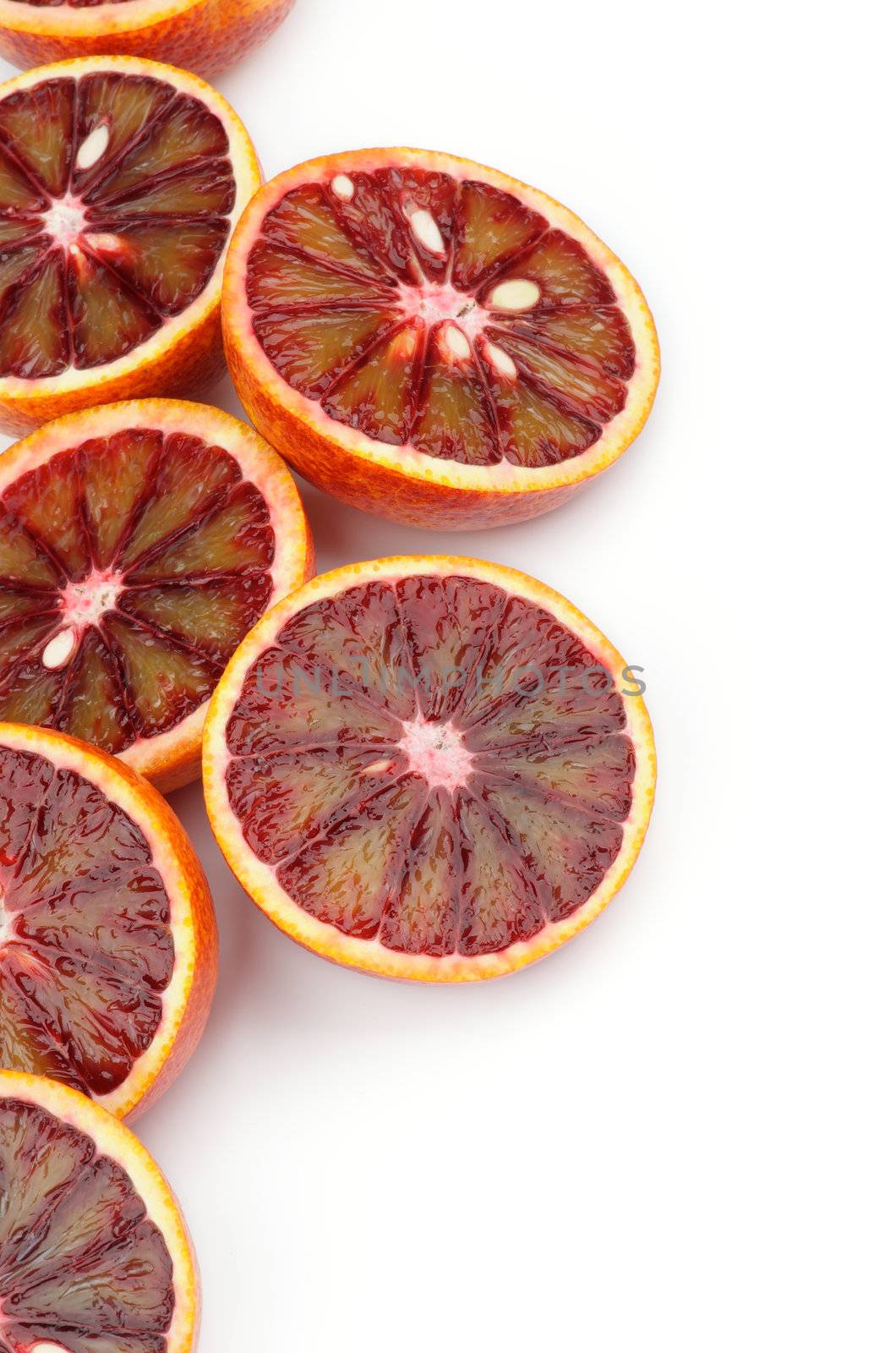 Halves of Blood Oranges as Frame closeup on white background