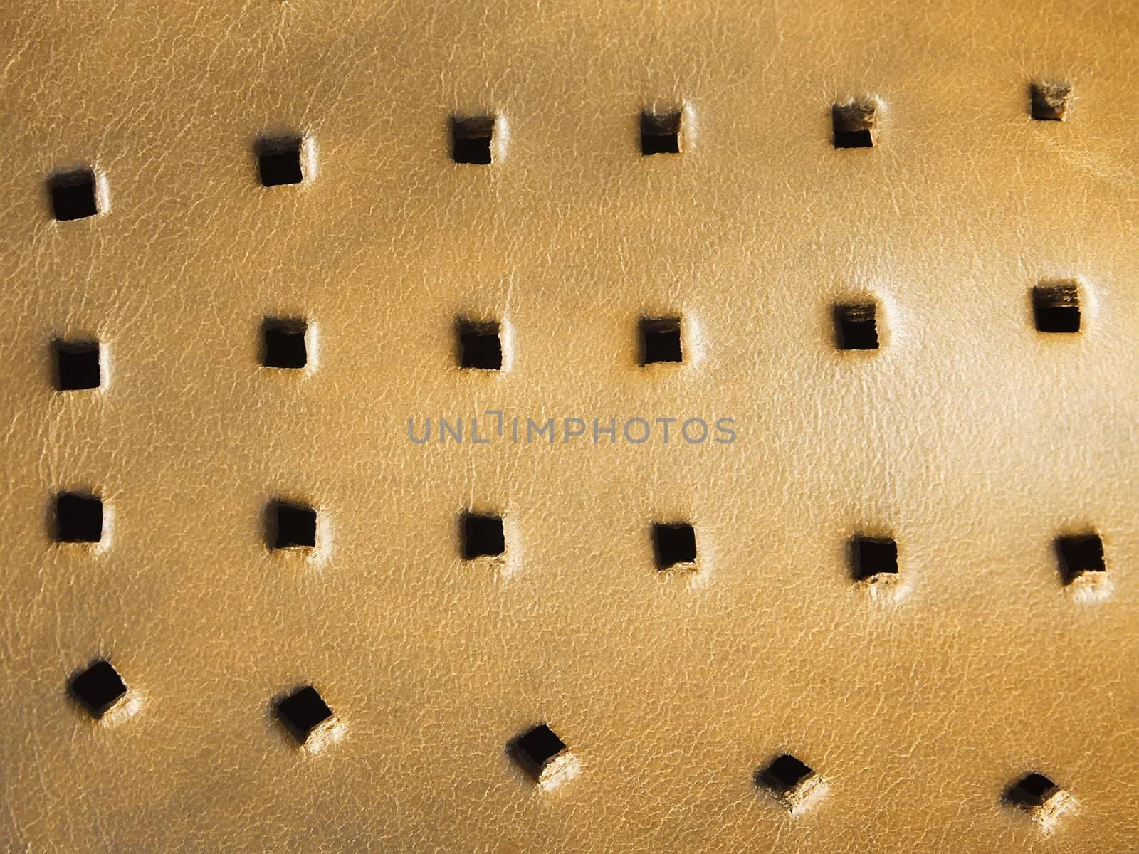 Detail of leather products with many slain square holes