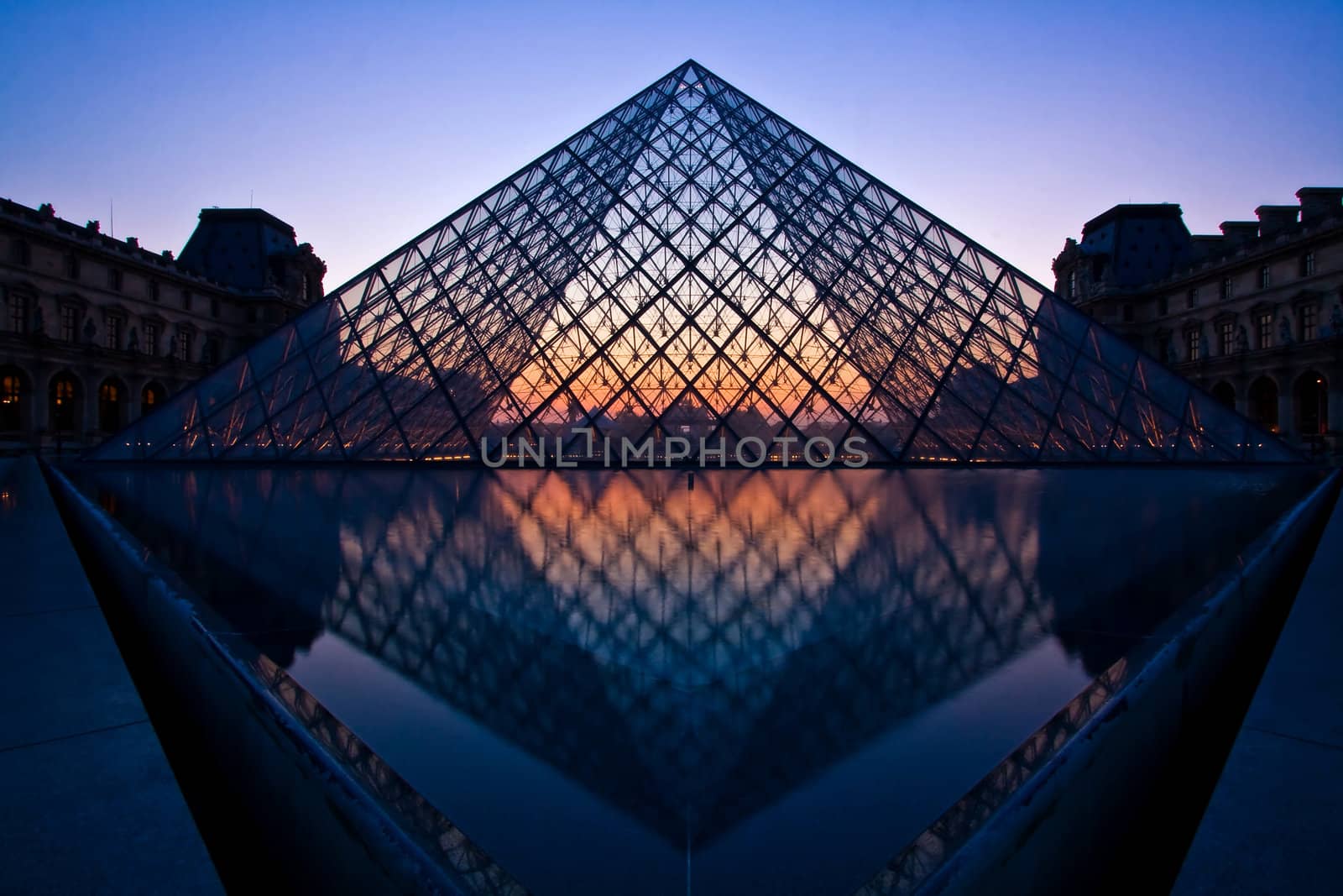PARIS - APRIL 16: Silhouette of Louvre pyramid at Evening during the Egyptian Antiquities Exhibition April 16, 2010 in Paris. This is one of the most popular tourist destinations in France.