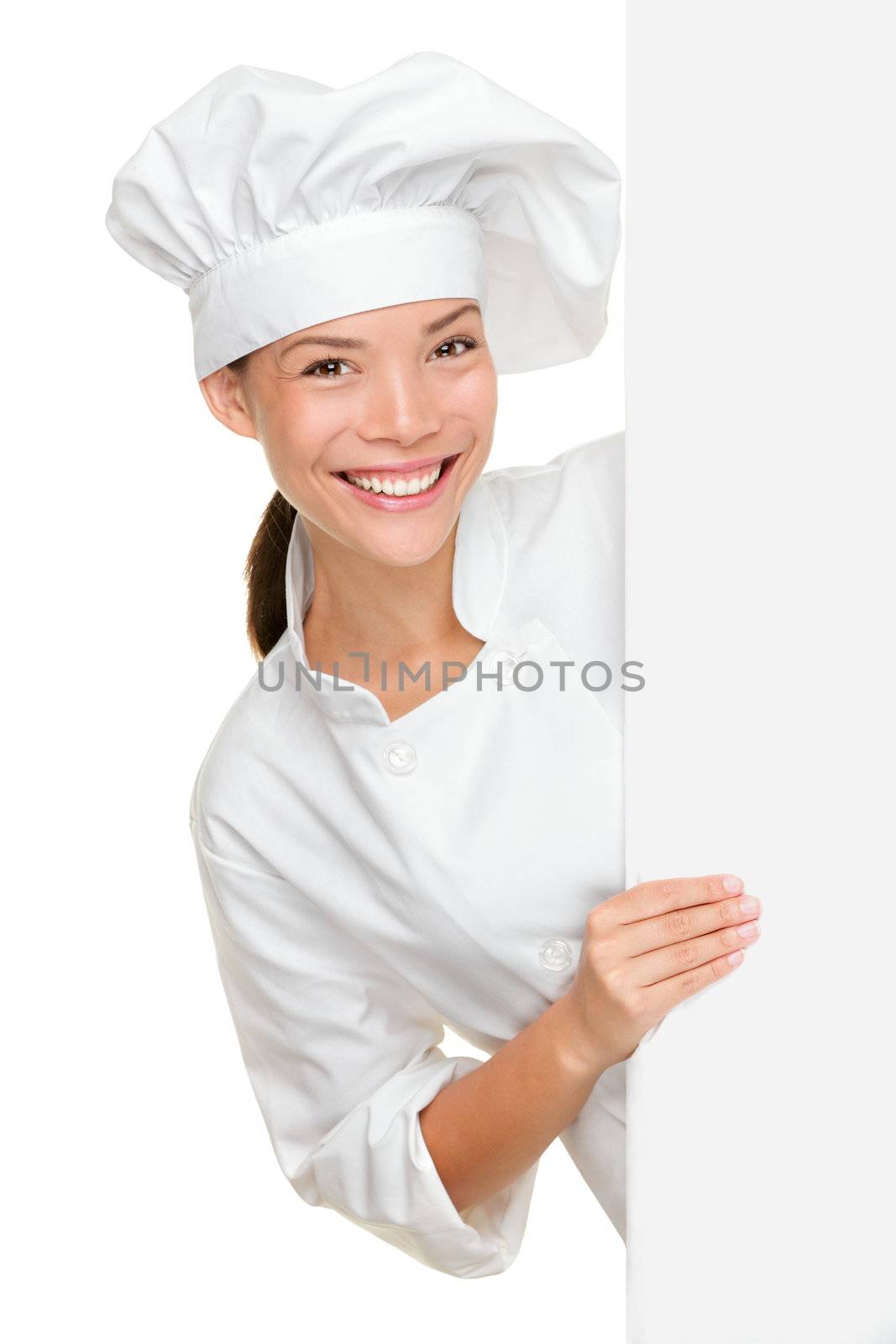 Chef showing blank sign. Woman chef, baker or cook smiling happy holding blank white paper sign isolated on white background. Beautiful young mixed race Asian Caucasian female model.