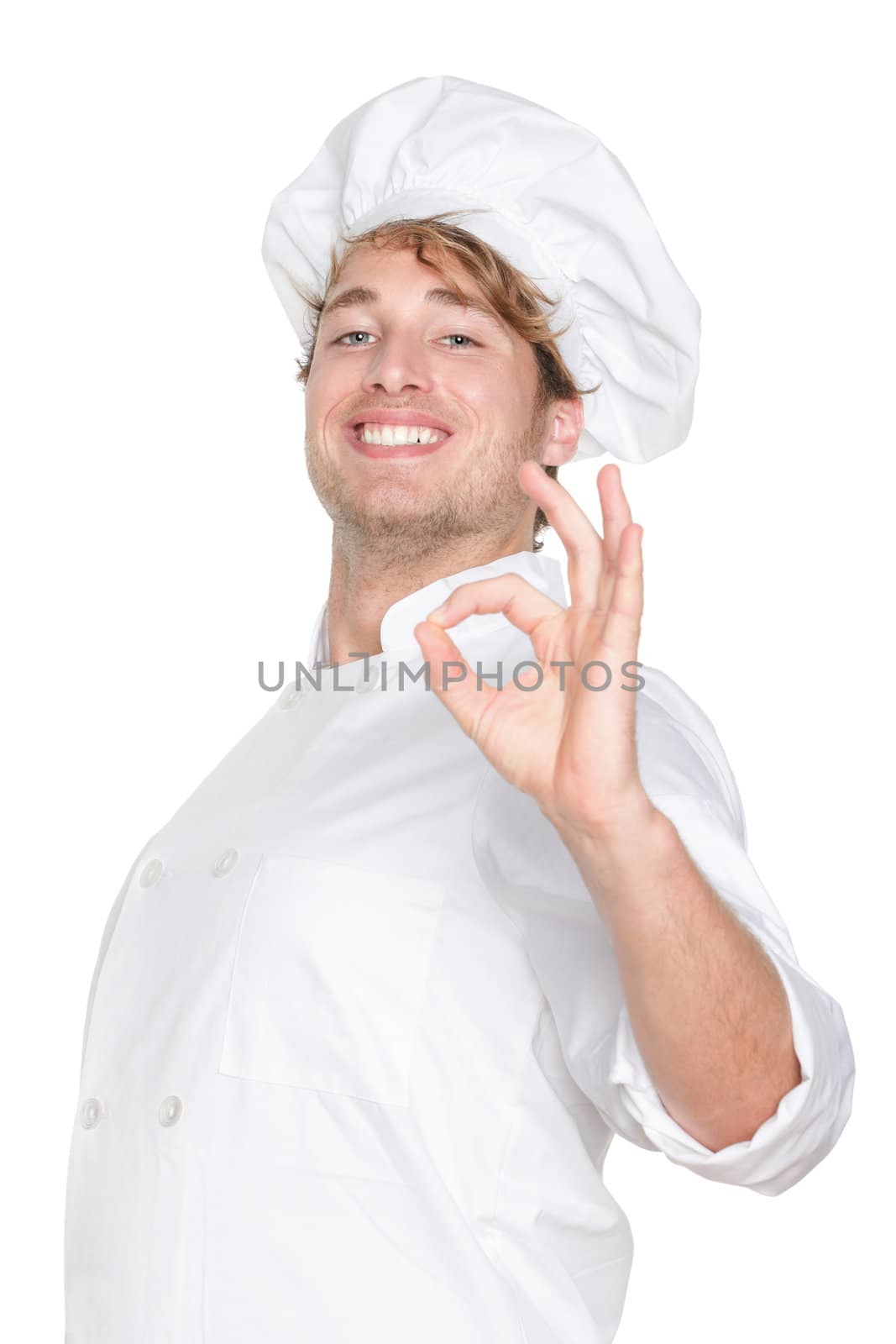 Chef. Chef, cook or baker showing hand sign for perfection and excellency smiling happy and proud looking at camera. Young caucasian male chef wearing chefs hat isolated on white background.