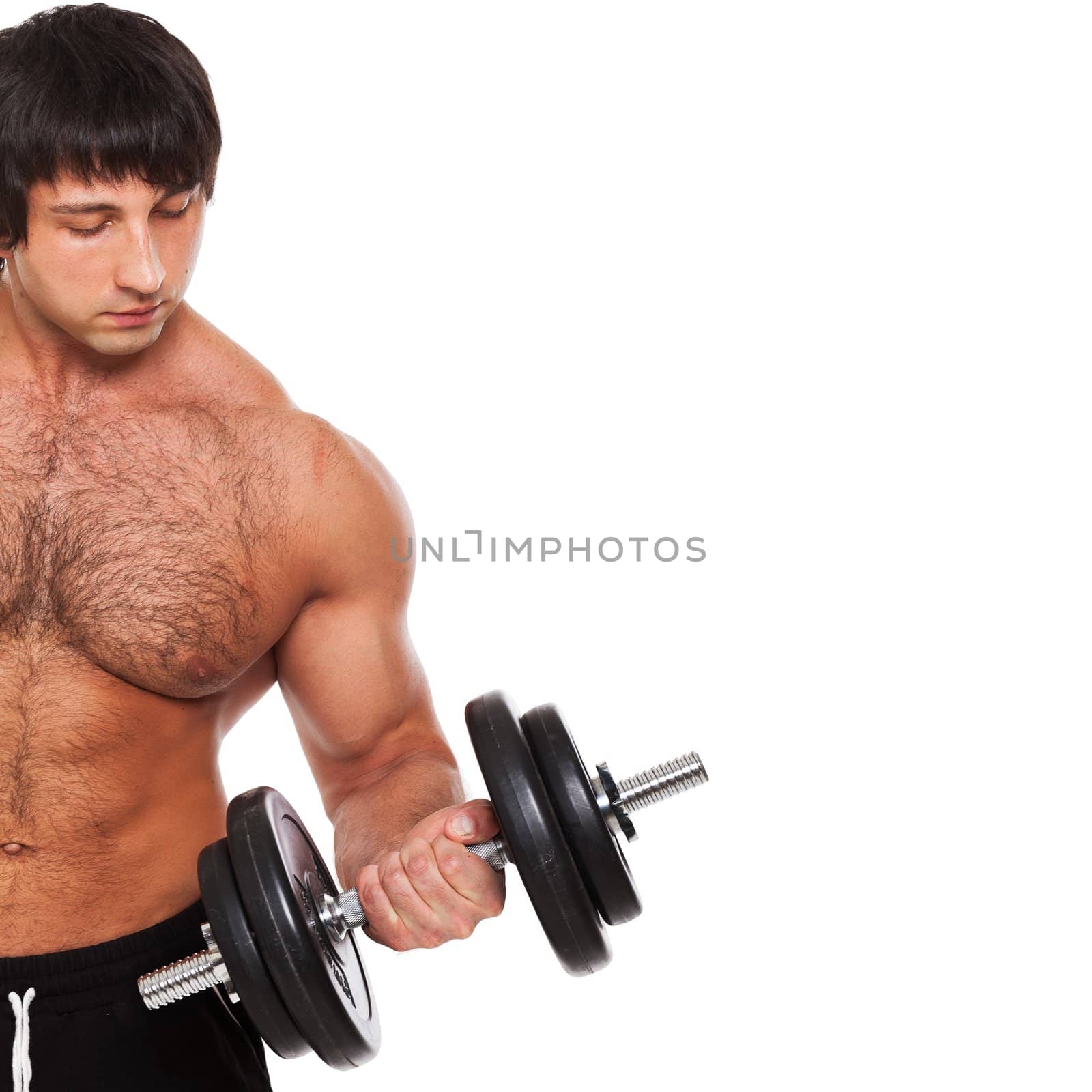 Muscular guy exercises with dumbbell on a white background