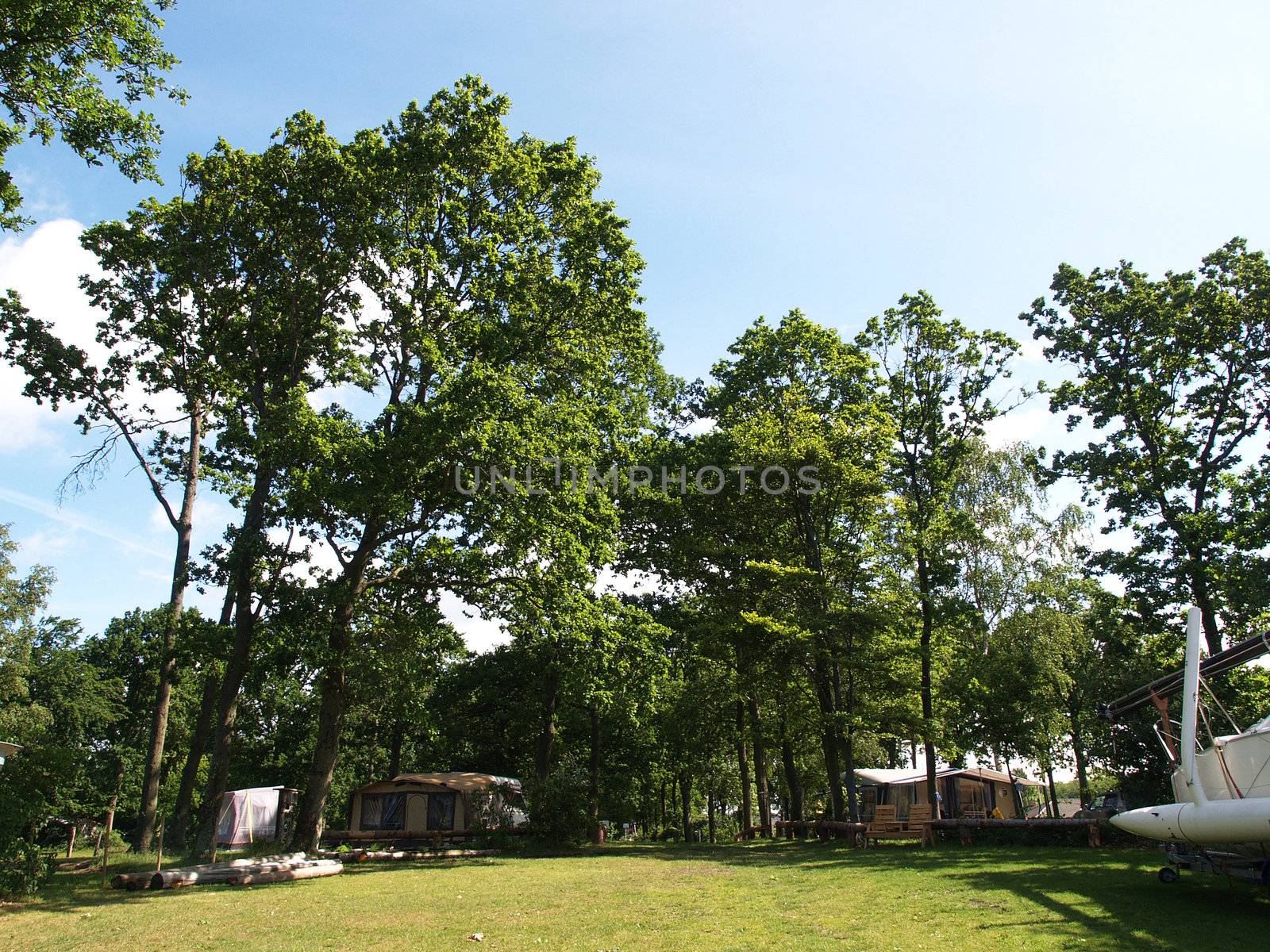 Caravans campers camping in a campground site out in nature