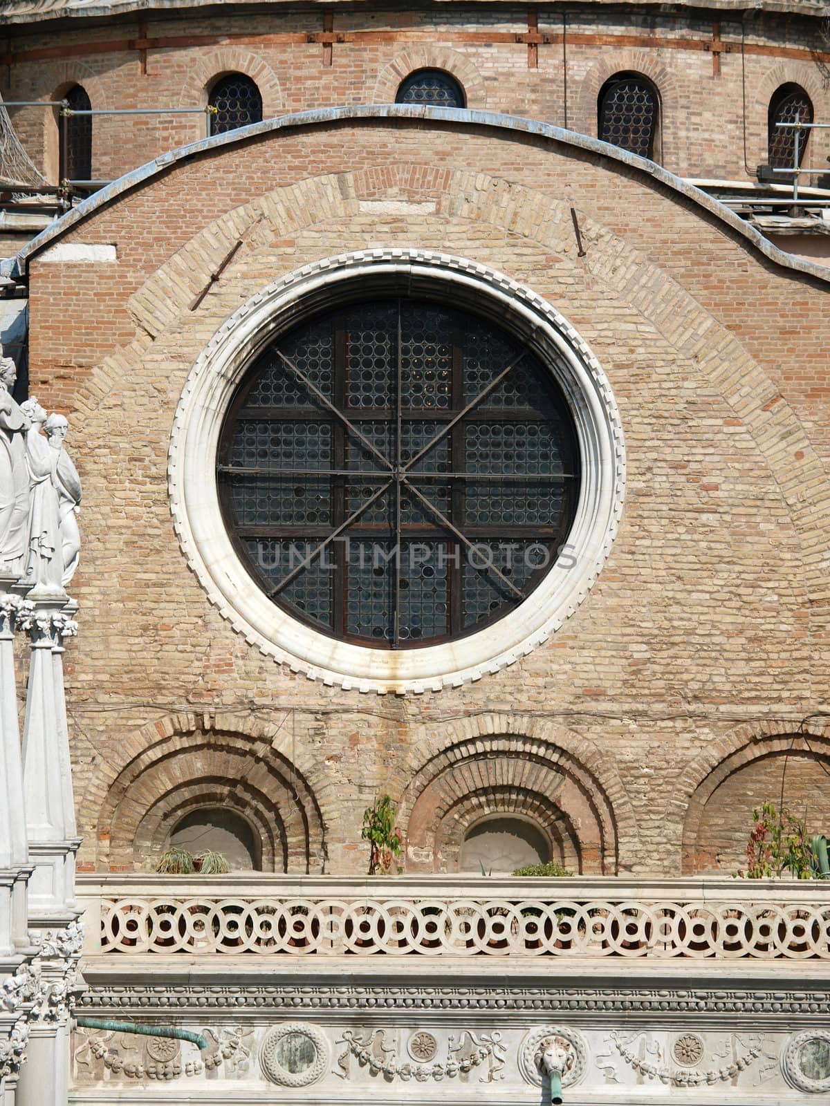 Beautiful window in the side part of the Basilica St Mark's in Venice 