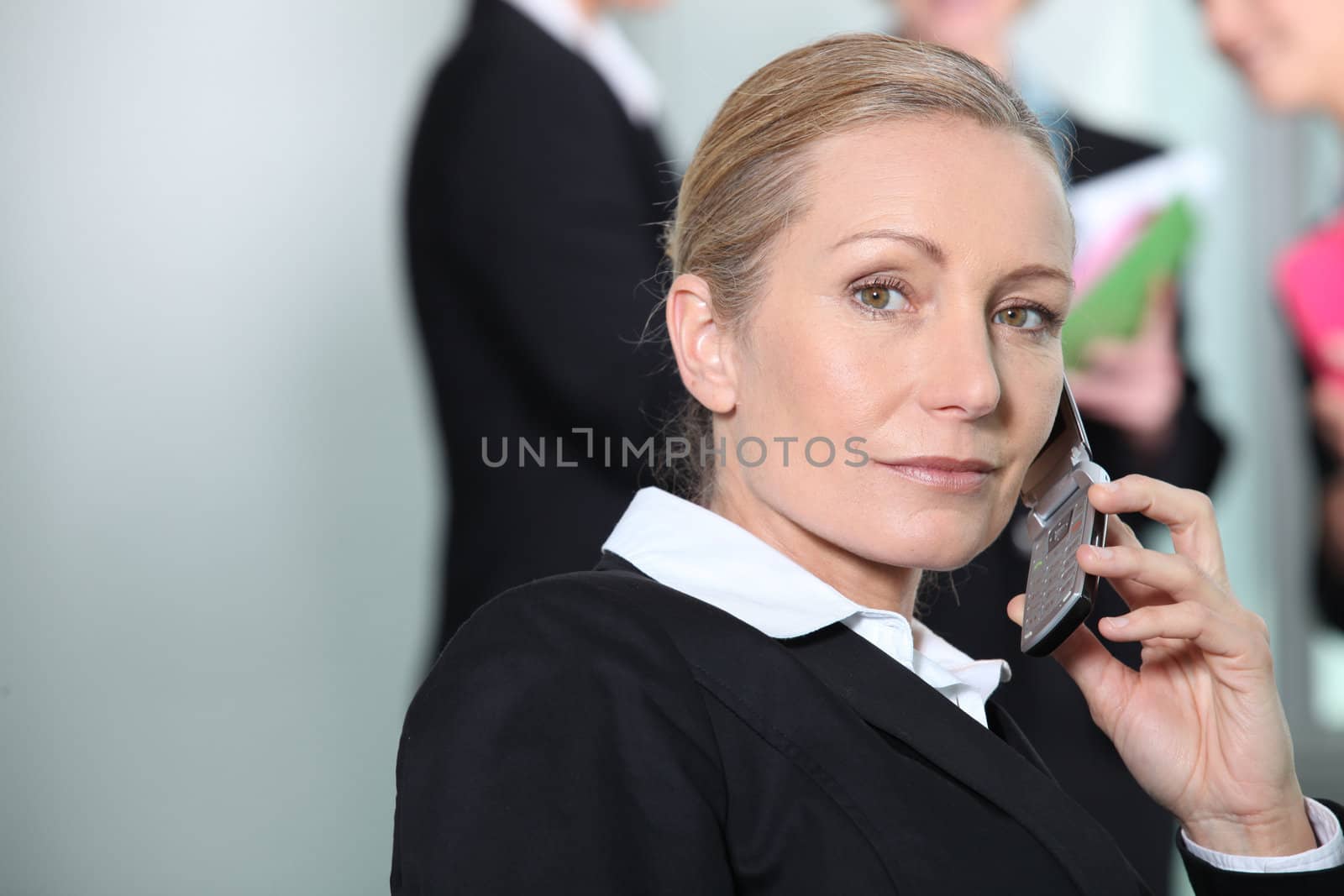 Businesswoman on the phone serious.