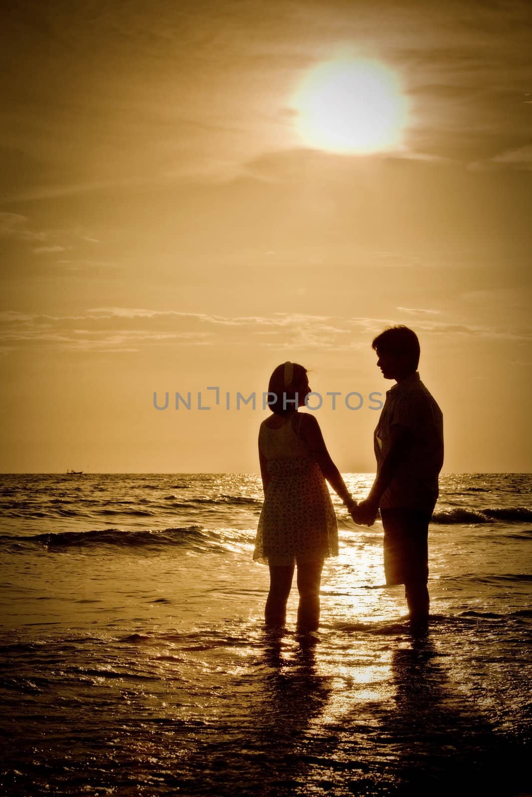 romantic Scene of couples on the Beach with sunset by vichie81