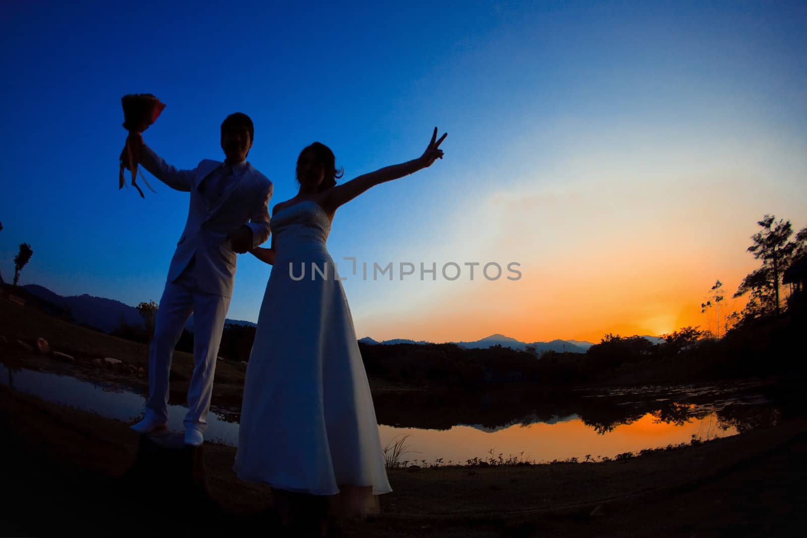 silhouette of romantic bride and groom