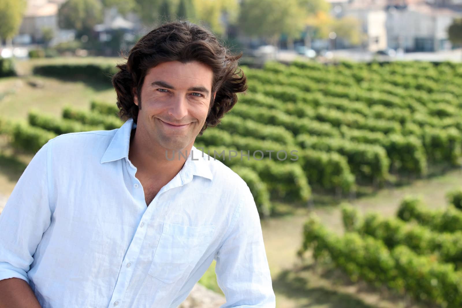 Man stood by vineyard