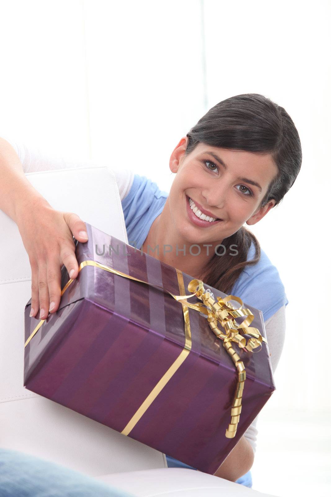 Woman holding gift by phovoir