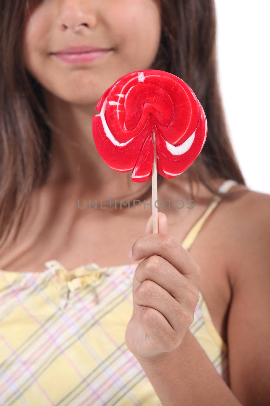 Girl holding a lolly pop