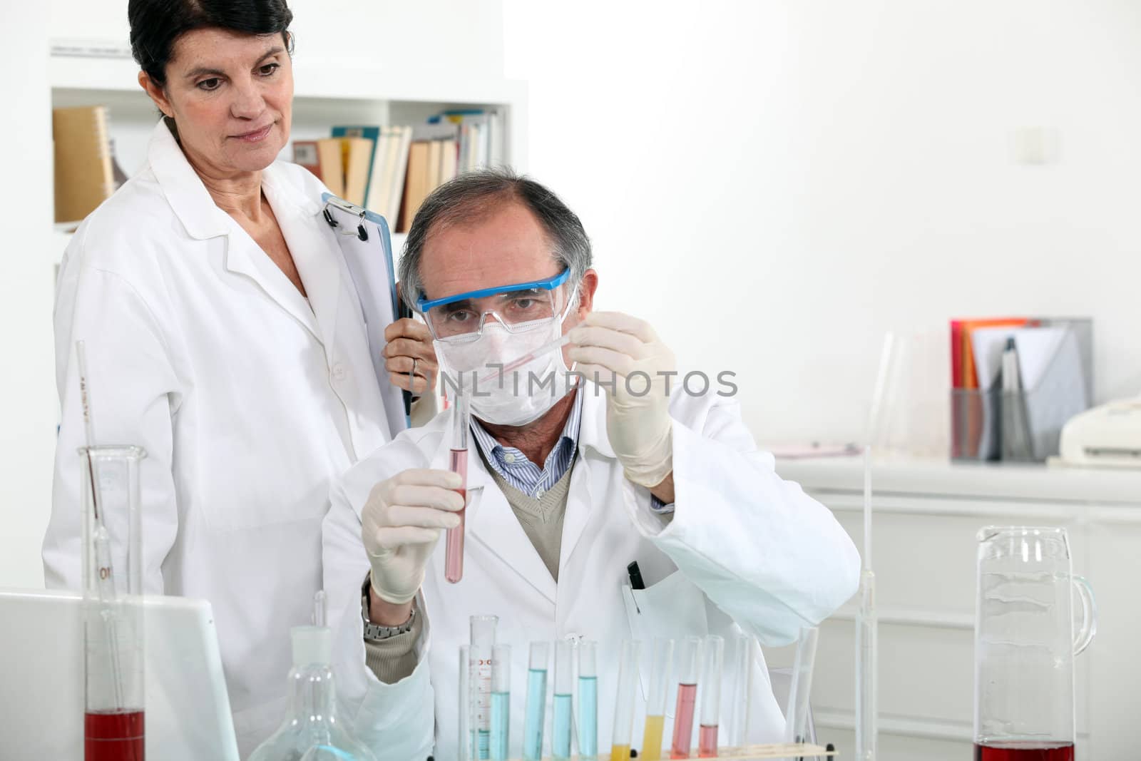 Man and woman in laboratory by phovoir