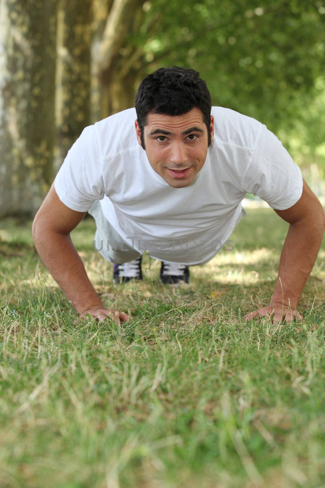 Man doing push-ups in the park