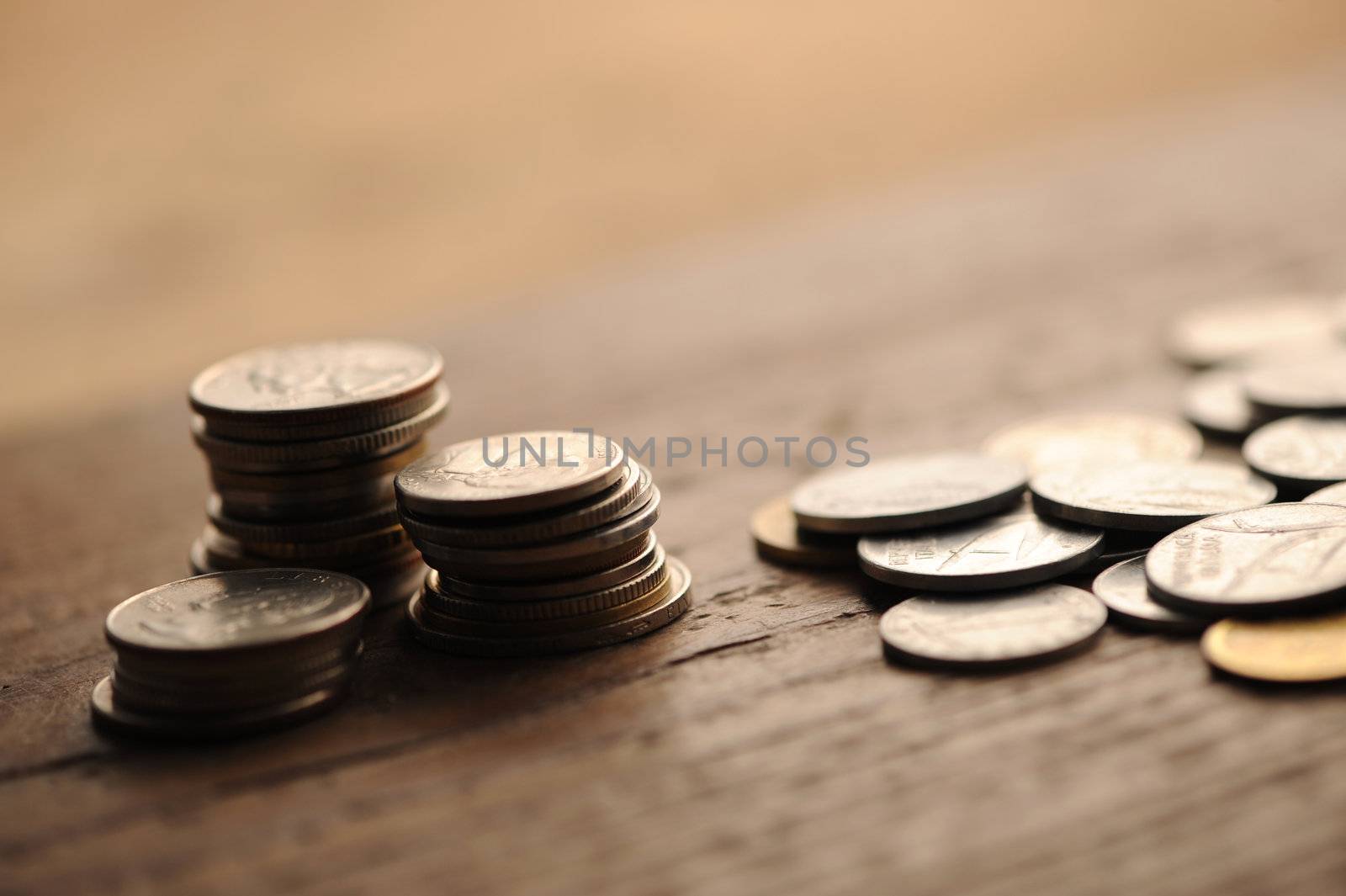 old coins on the wooden table, shallow dof by stokkete