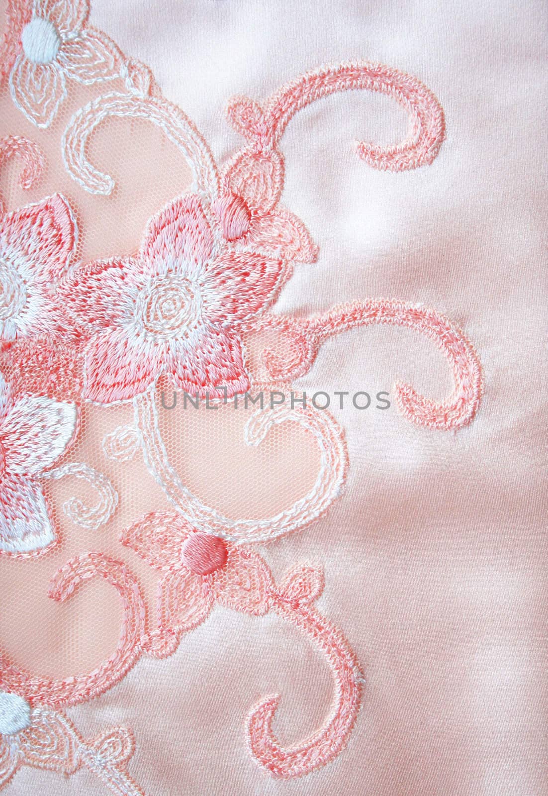 Flower lace on the elegant pink silk can use as wedding background