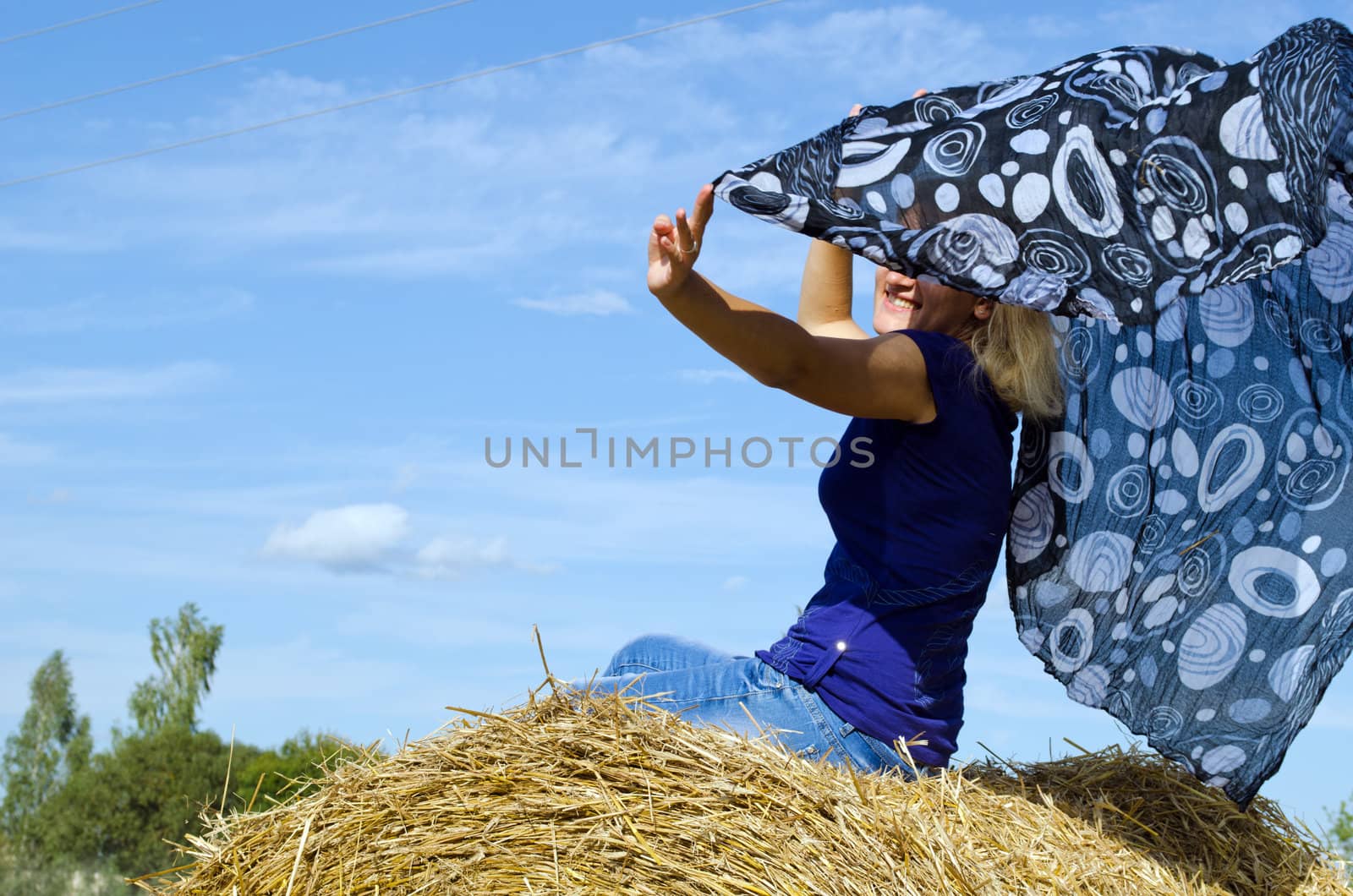 woman happy smile straw bale headscarf scarf wind by sauletas